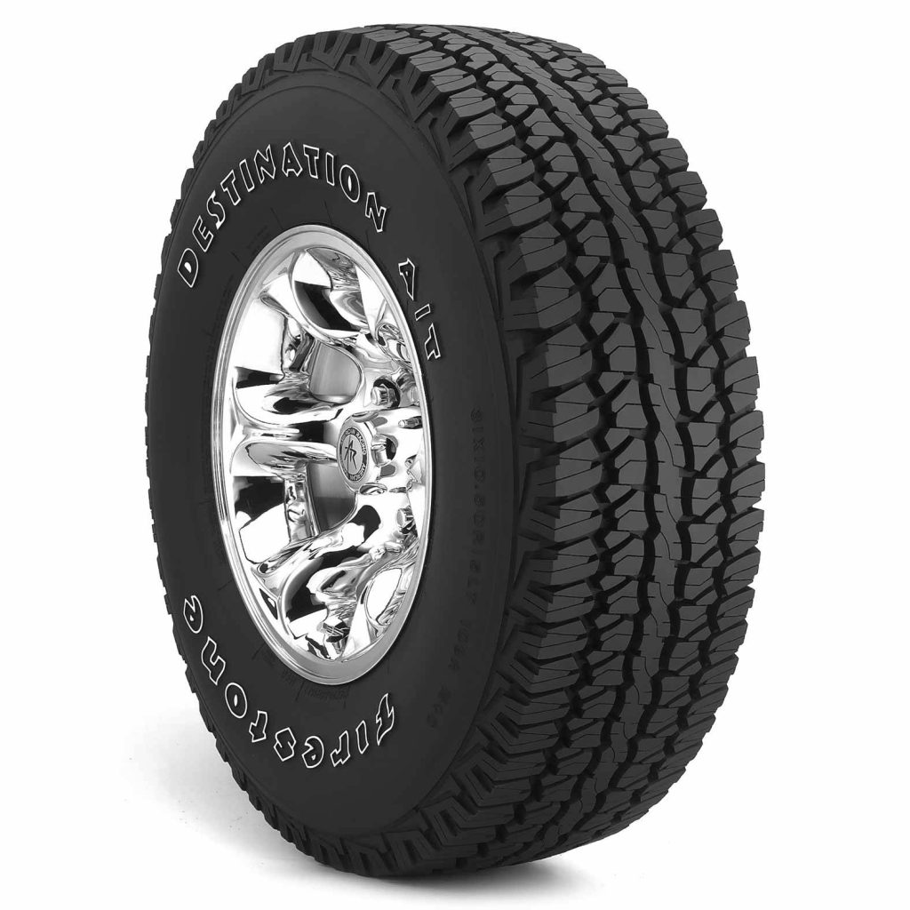 Firestone Destination AT tire on shiny American Racing chrome wheel deep tread white background Wallpaper