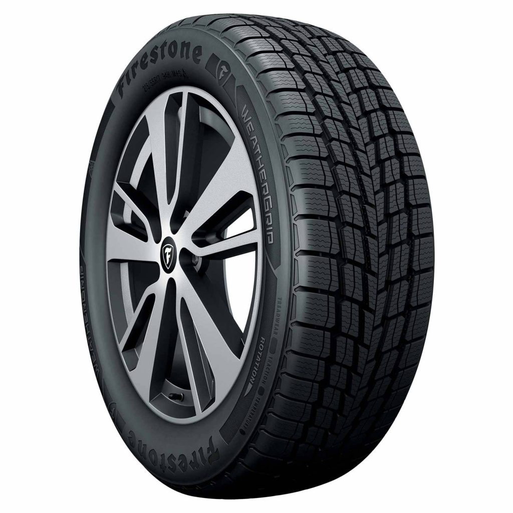 Firestone WeatherGrip tire on silver alloy wheel detailed tread 215/55R17 sidewall close-up Wallpaper