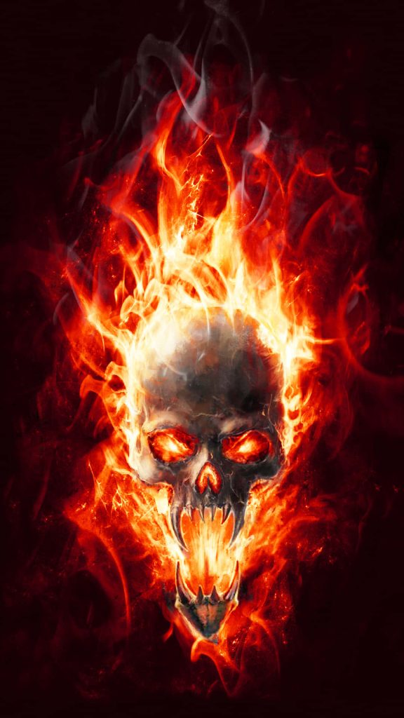 Flaming skull with sharp teeth in fiery red and orange flames on dark fantasy background wallpaper