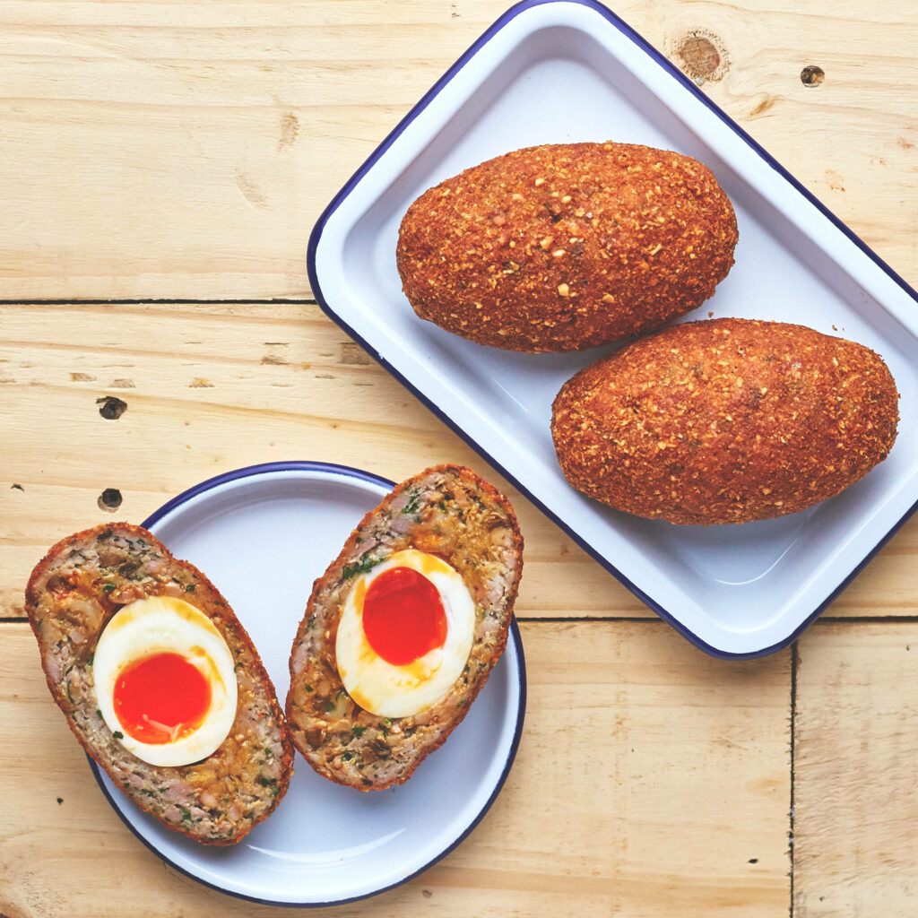 Delicious Scotch Eggs: Golden Crispy Coating & Perfect Egg Inside Wallpaper