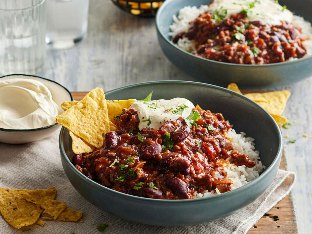 Flavor-Packed Chili Con Carne Over Rice - Hearty Wallpaper Background