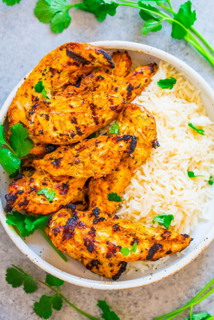 Flavorful Tandoori Chicken with Basmati Rice - Vibrant Wallpaper Background