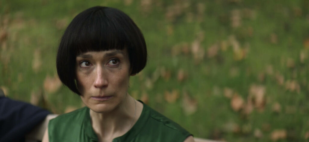 Fleabag Sister Wallpaper: Intense Emotions Against Nature's Blur