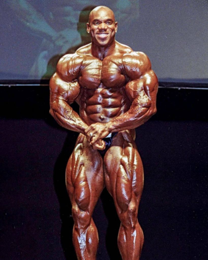 Flex Wheeler IFBB pro bodybuilder in dramatic lighting showing muscular definition and symmetry Wallpaper
