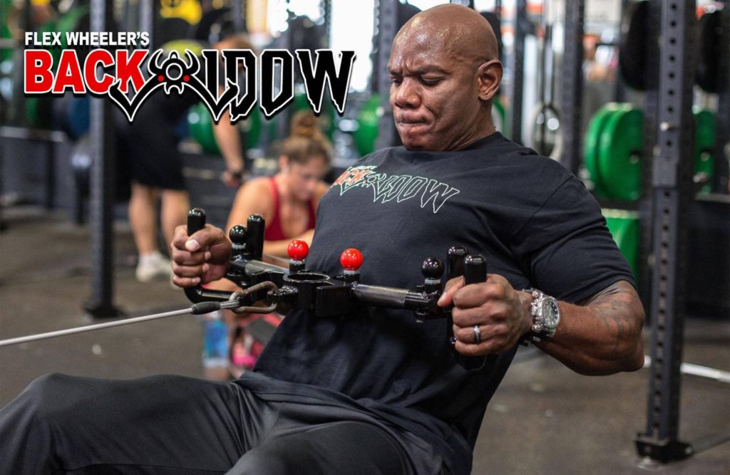 Flex Wheeler intense seated row workout on Back Widow device showcasing muscular physique Wallpaper