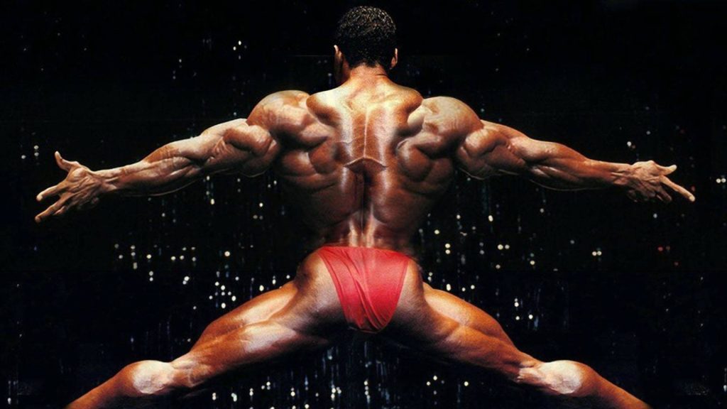 Flex Wheeler bodybuilding wallpaper showcasing muscular back symmetry with moody lighting effects