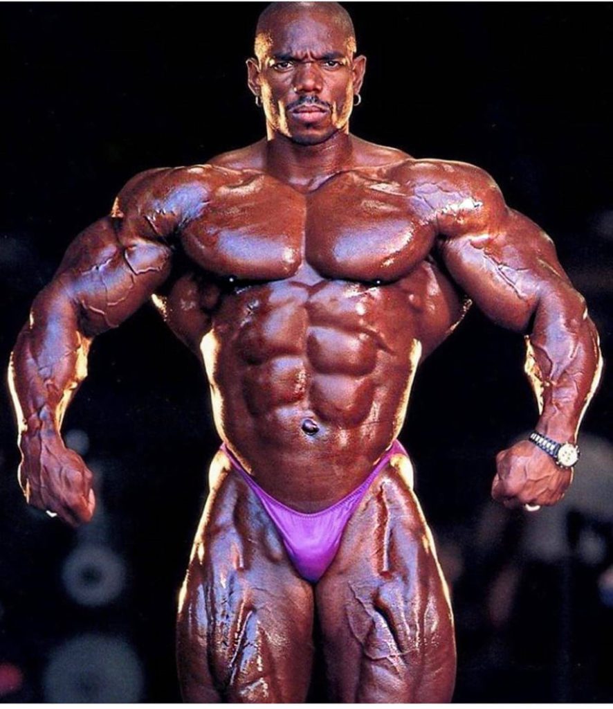 Flex Wheeler bodybuilding wallpaper showcasing muscular physique with dramatic lighting and vascularity
