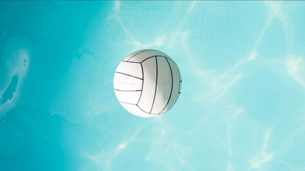 Serene Aquatic Vibes: A Mesmerizing Volleyball 4k Background Photograph Showcasing a Floating White Ball amidst Crystal-Blue Water Wallpaper