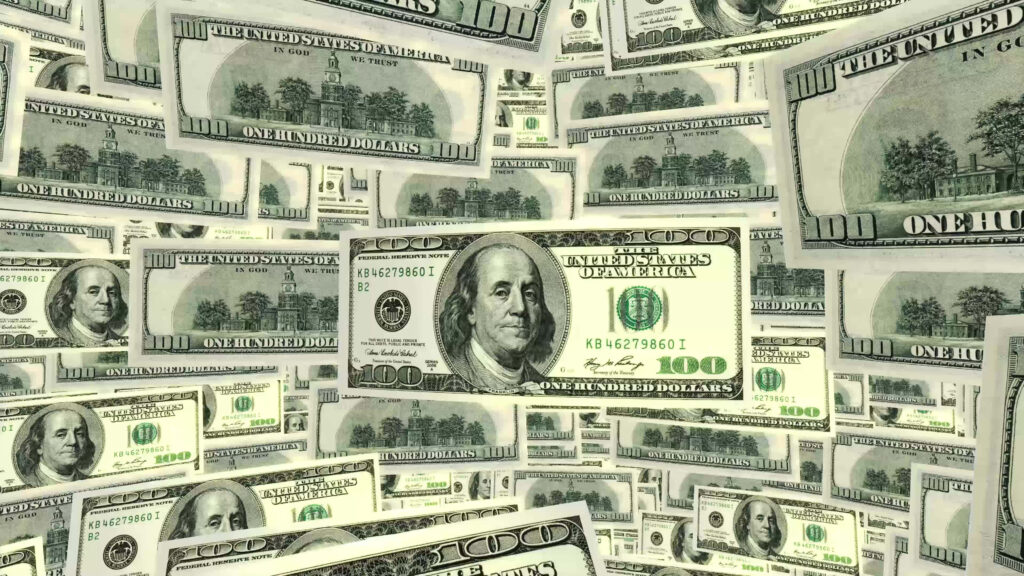 Currency Cascade: Mesmerizing 100-Dollar Bills Grace Your Desktop Wallpaper