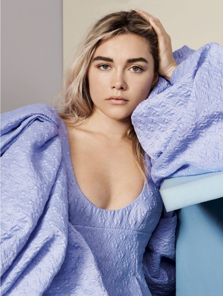 Florence Pugh in textured periwinkle top with voluminous sleeves serene studio portrait high fashion Wallpaper