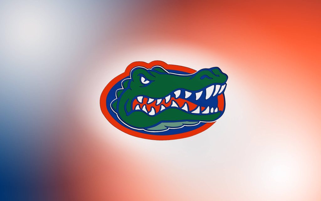 Florida Gators logo wallpaper with alligator mascot on blue and orange gradient background