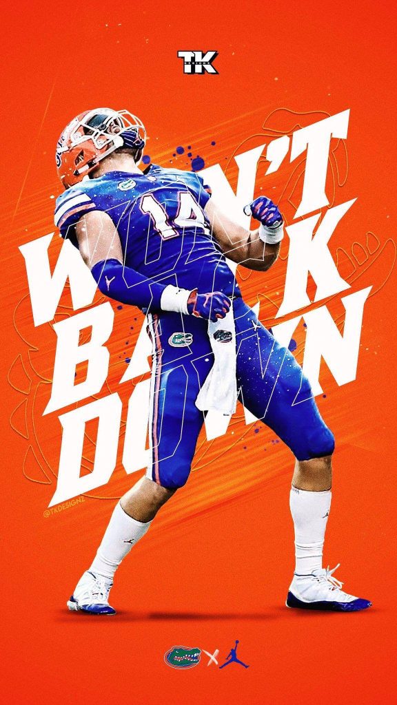 Florida Gators football player in blue jersey against orange background with Won't Back Down slogan Wallpaper