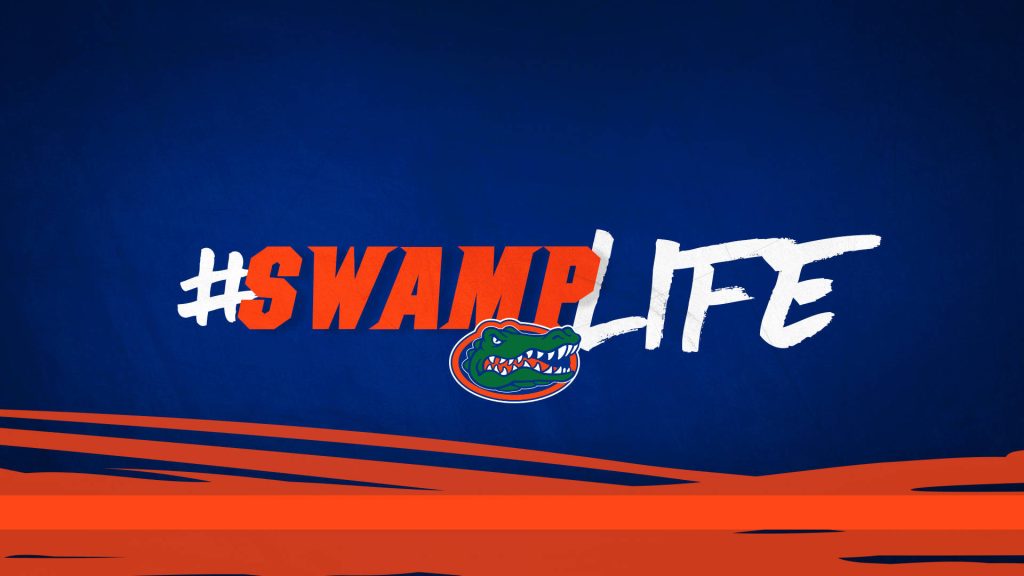 Florida Gators mascot logo with #SWAMPLIFE hashtag and vibrant orange brush strokes background Wallpaper