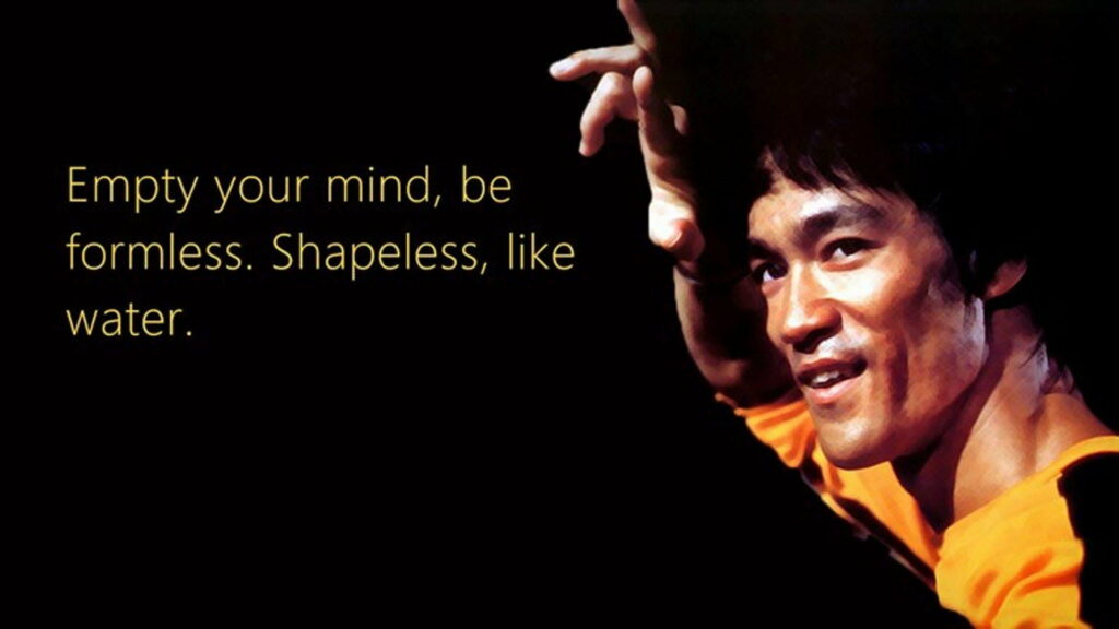 Dancing with Fluidity: Bruce Lee's Inspiring Words Unleashed in this HD Wallpaper