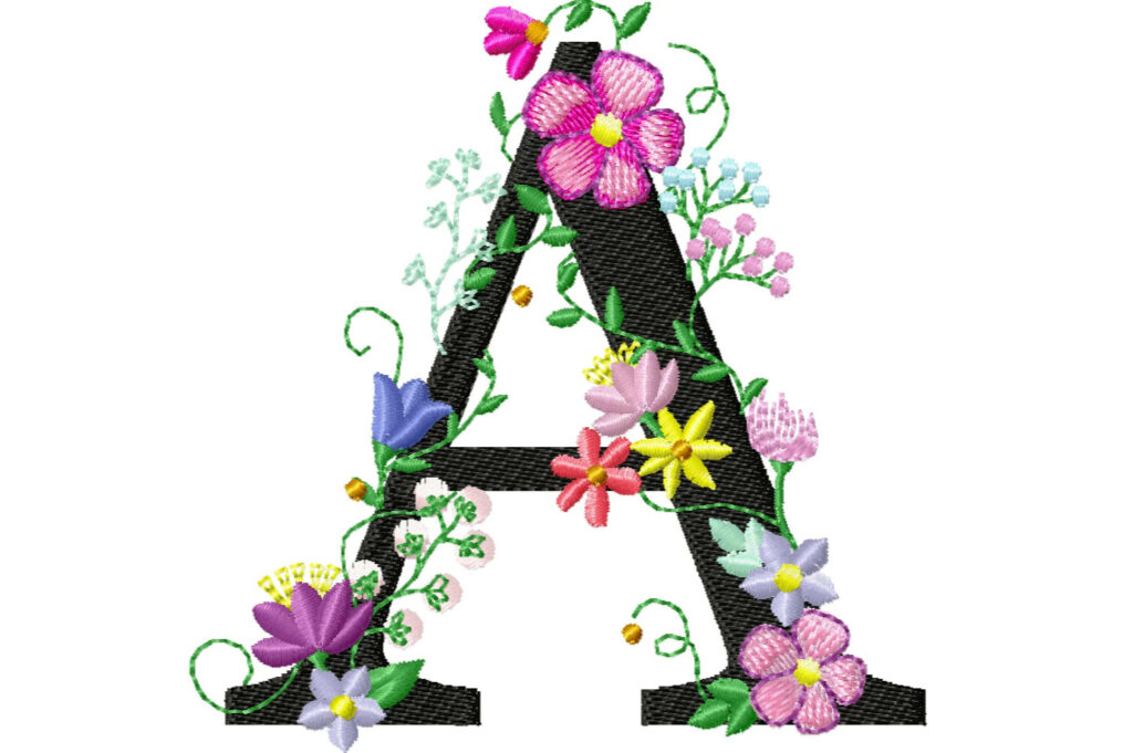 Embroidered letter A with black font and colorful pink purple yellow floral vines on wallpaper