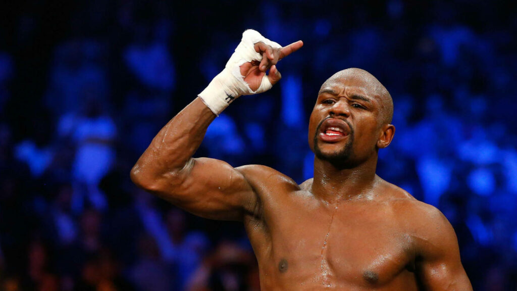 Floyd Mayweather Celebrates Victory: Energetic Wallpaper Background