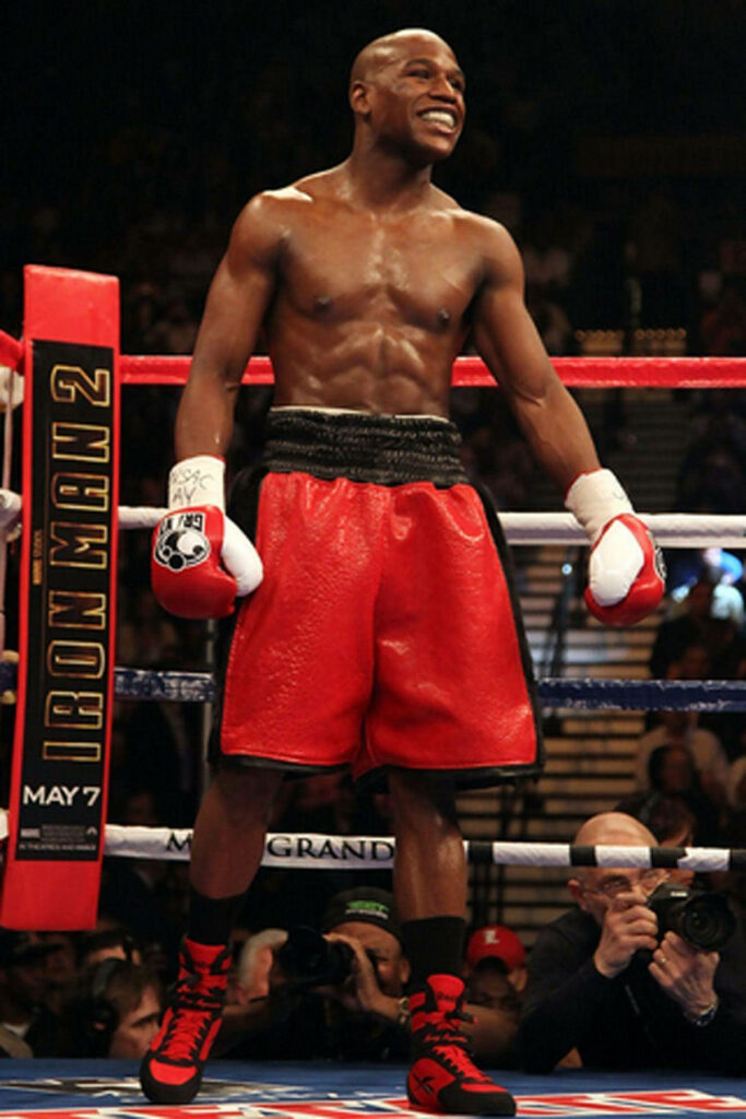 Floyd Mayweather in Red Trunks: Confident Boxing Victory Wallpaper