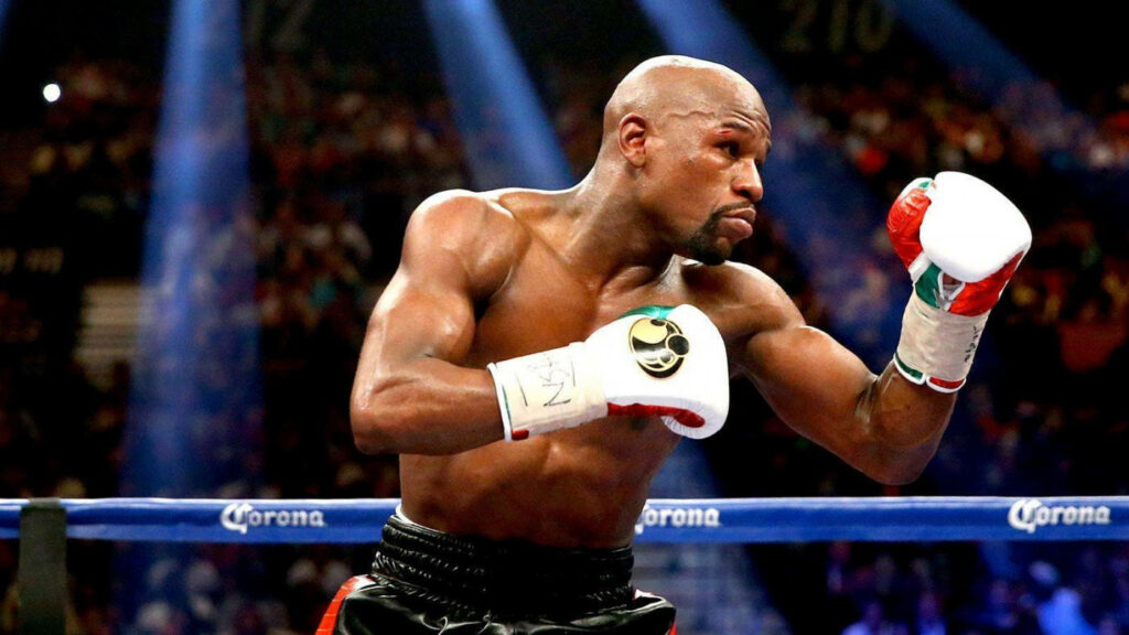 Floyd Mayweather in Action: Dynamic Boxing Wallpaper Background