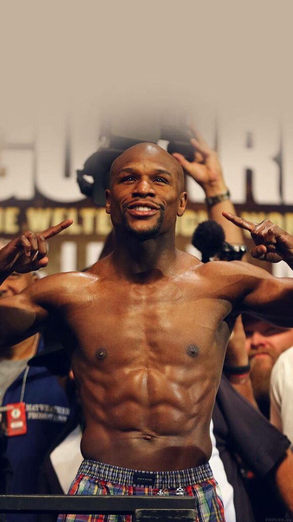 Floyd Mayweather's Charismatic Smile: Energetic Wallpaper Background