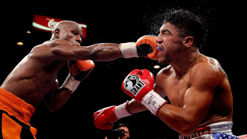 Floyd Mayweather's Powerful Punch: Intense Boxing Match Wallpaper