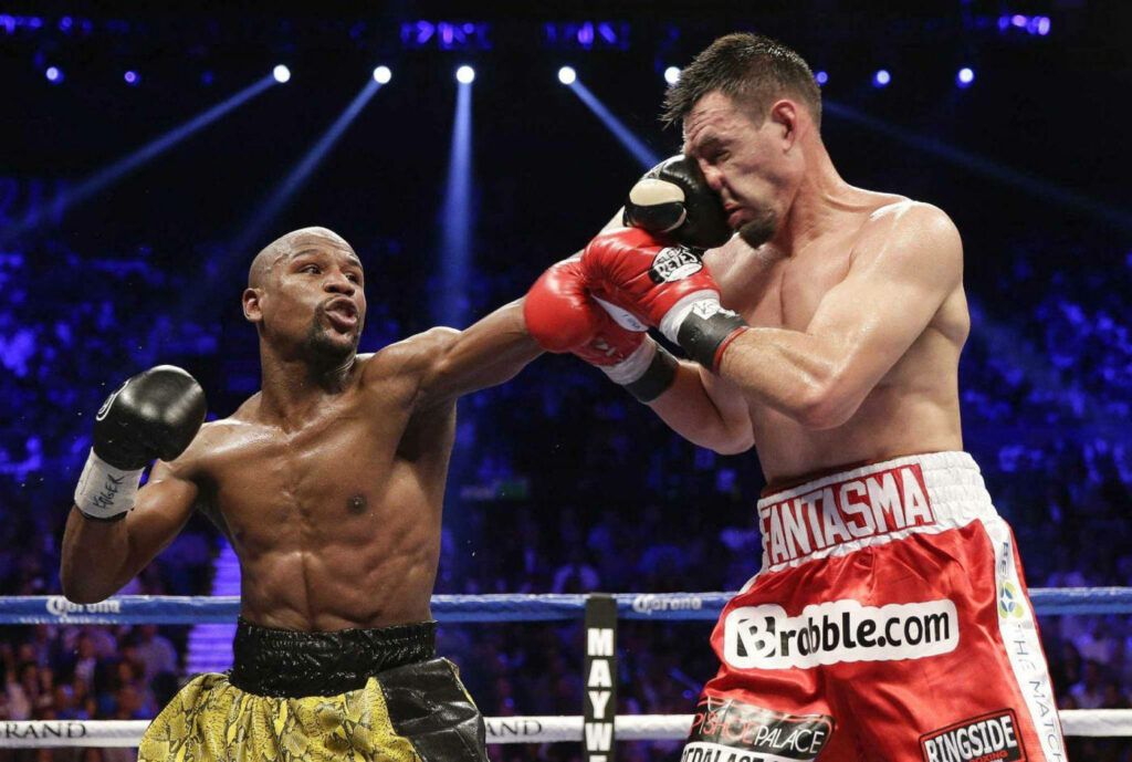 Floyd Mayweather's Lightning Jab: Intense Boxing Match Wallpaper