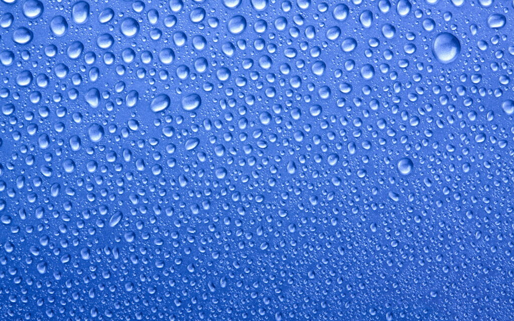 Aqua Symphony: Captivating Macro Drops On Serene Blue Canvas Wallpaper