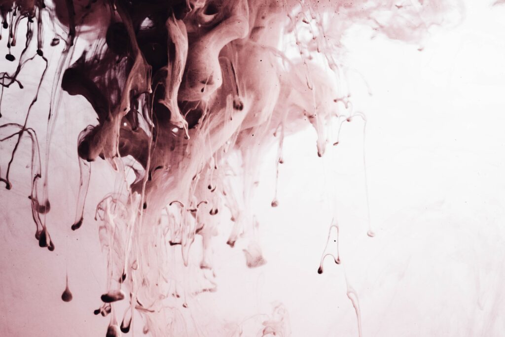Abstract Paint Drops Wallpaper: Fluid Motion on Soft Background