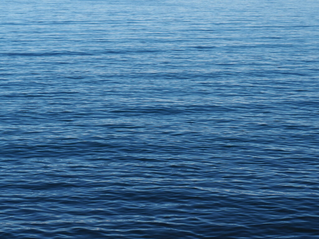 Aquatic Elegance: Captivating 4K Wallpaper of Wavy Water Ripples