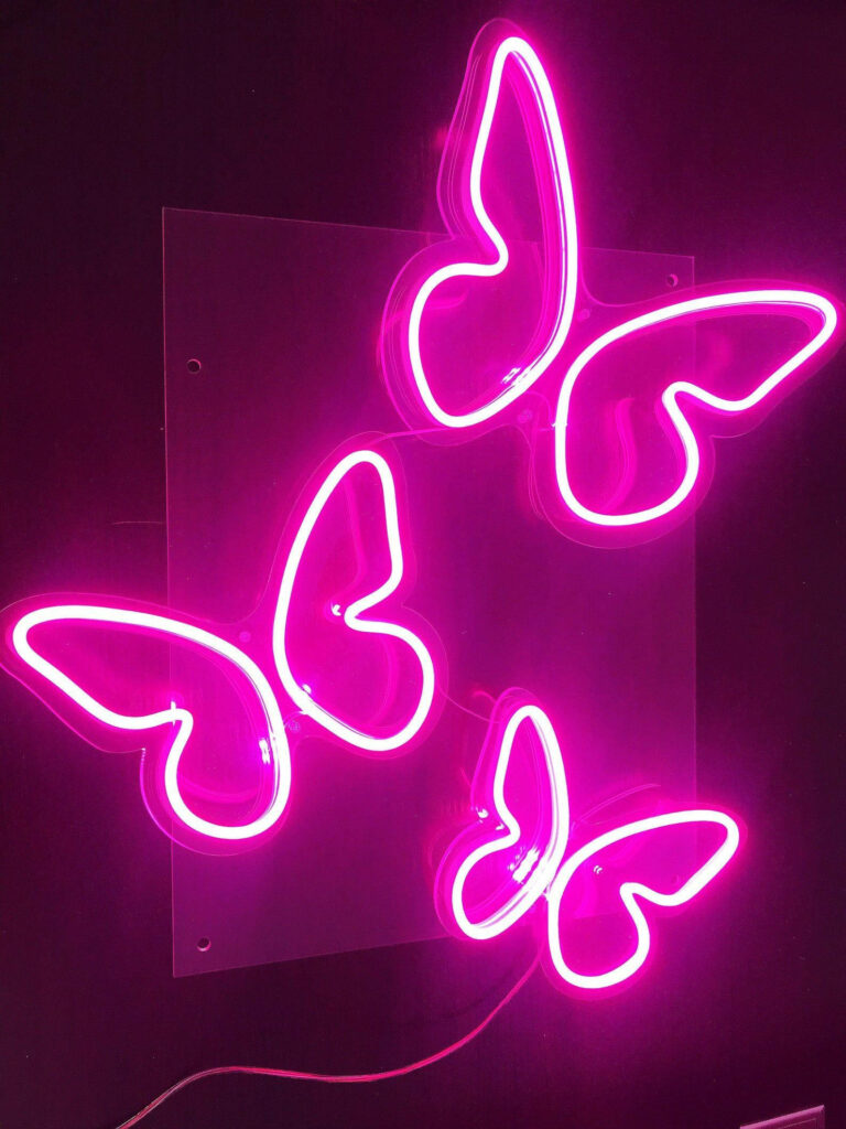 Vibrant Neon Pink Butterfly Trio: Eye-catching Phone Wallpaper
