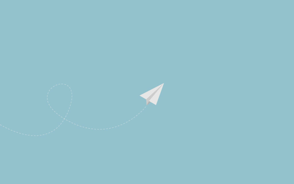 Fly Away with a Folded Paper Plane on Pastel Blue Background Wallpaper