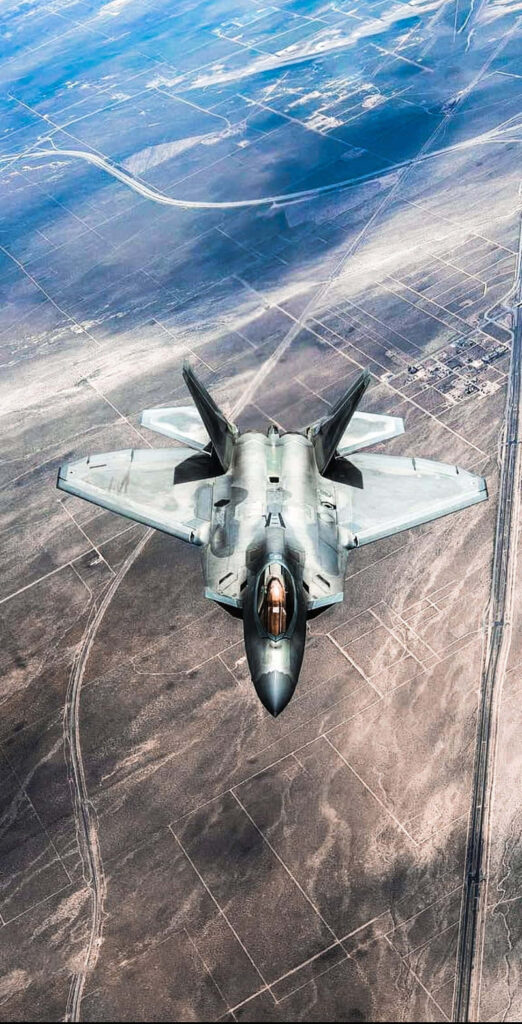 Dynamic Aerial Dominance: The Mighty F-22 Raptor in Flight Wallpaper