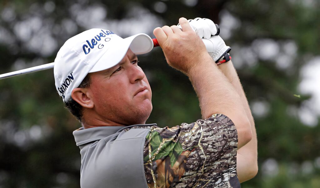 Boo Weekley golf swing action with Cleveland Golf cap intense focus outdoor sports wallpaper