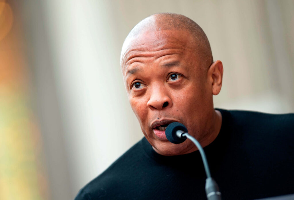 Dr. Dre Speaking into Microphone: Professional Wallpaper Background