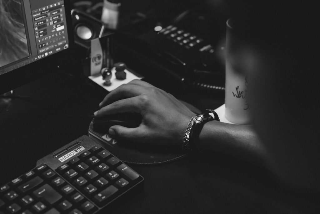 Focused Productivity: Black & White Computer Setup Wallpaper