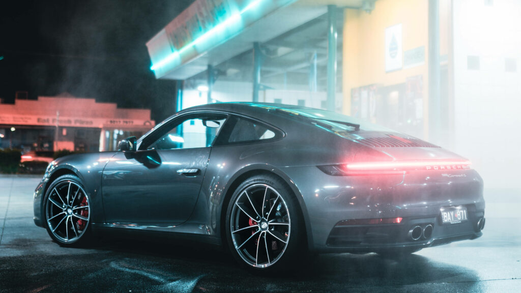 Mesmerizing Night Scene: Black Porsche Carrera Enchantingly Parked Amidst a Misty Ambiance in Forza 4 Wallpaper