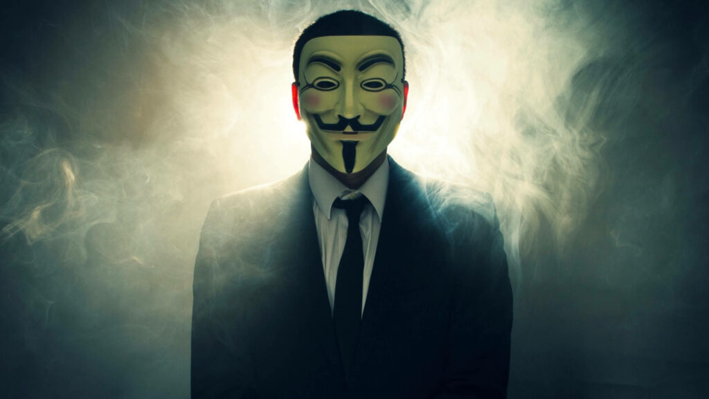 Foggy Intrusion: Cyber Espionage Unveiled - A Captivating 4k Wallpaper Depicting an Anonymous Hacker in a Suit Unleashing Digital Mayhem