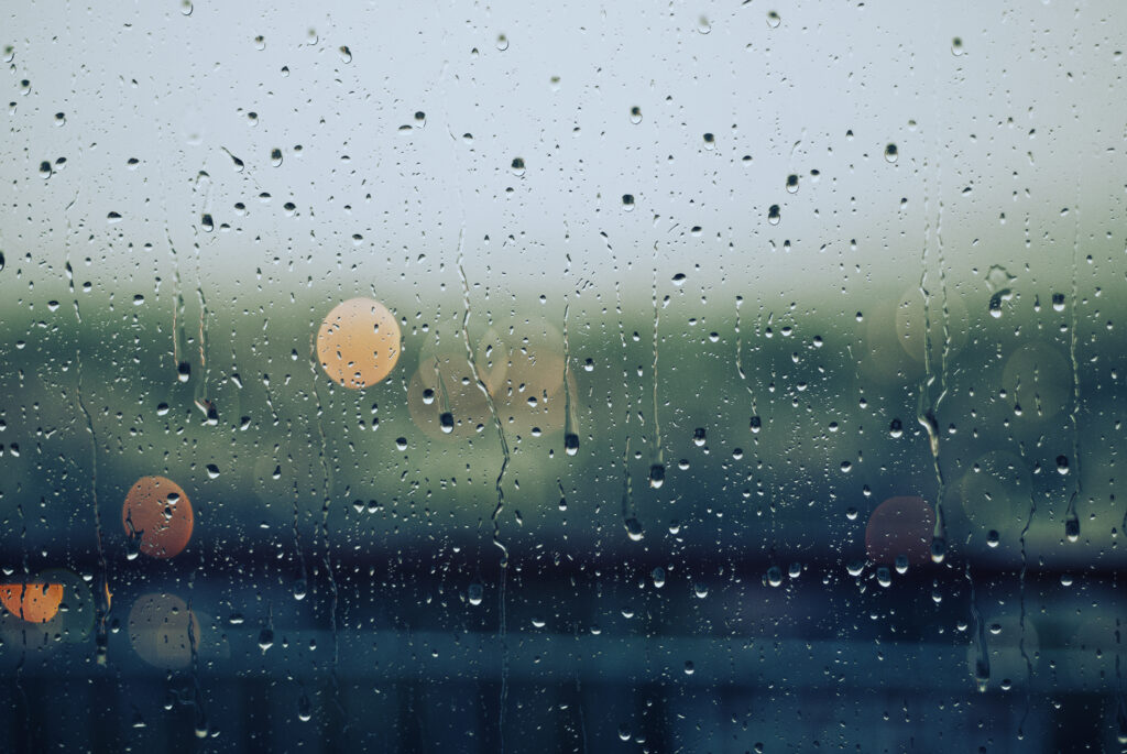 Macro Foggy Window with Water Droplets & Blurred Background Lights Wallpaper