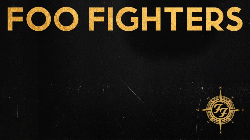 Foo Fighters wallpaper with bold gold letters and compass logo on dark gritty textured background