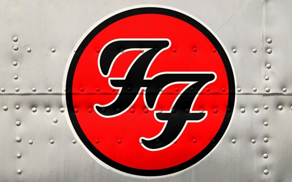 Foo Fighters wallpaper with iconic double-F logo on rugged riveted metal background