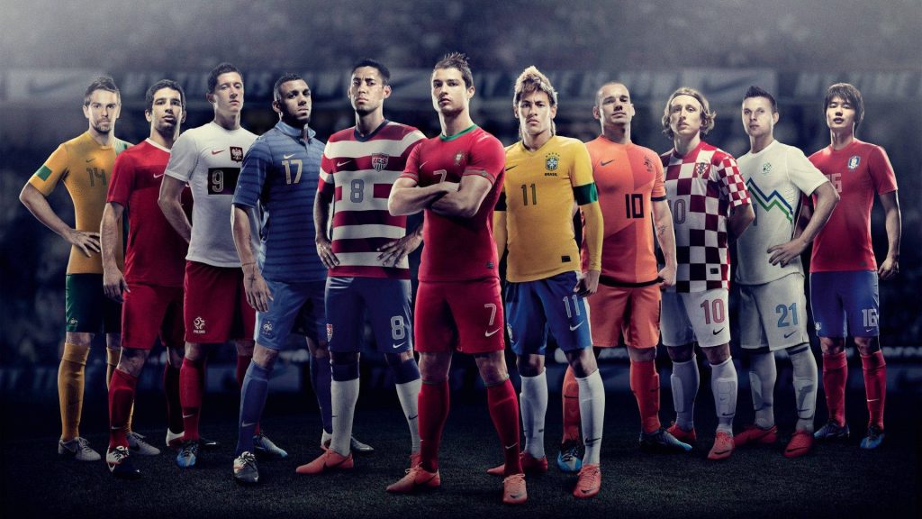 Football wallpaper with Ronaldo Neymar Modrić Lewandowski in stadium lighting, national kits