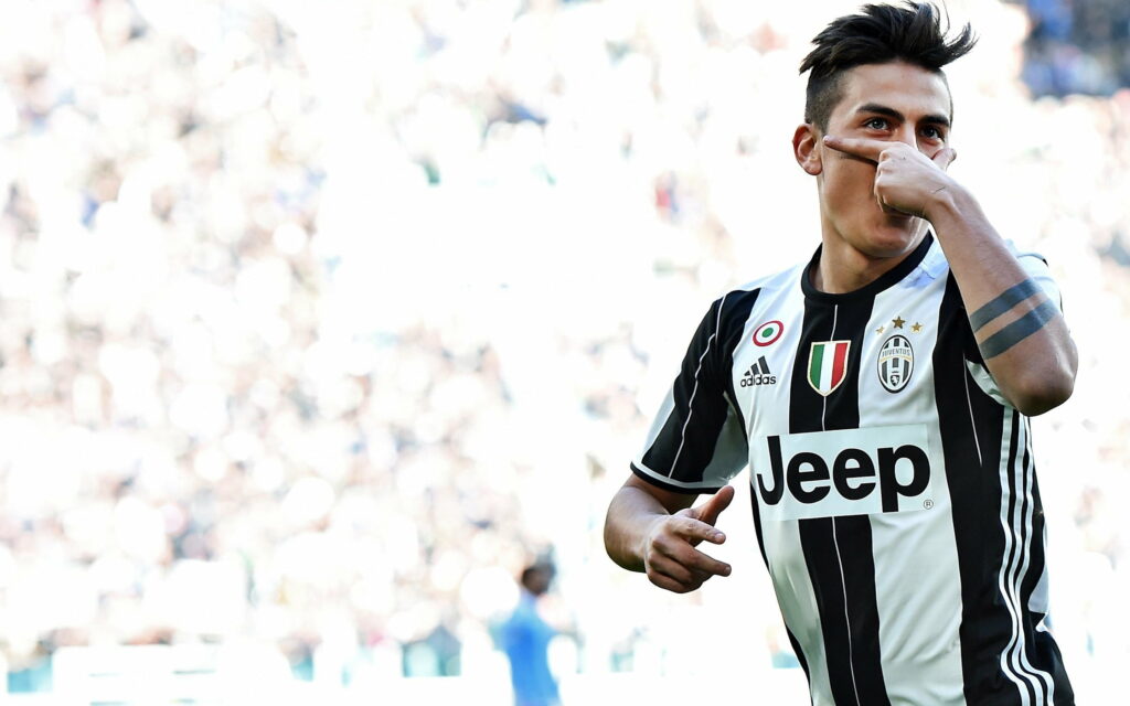 Paulo Dybala: Juve's Footballing Maestro Strikes a Goal as Bianconeri Reign Supreme - QHD Wallpaper Background Featuring Serie A's Stellar Soccer Star