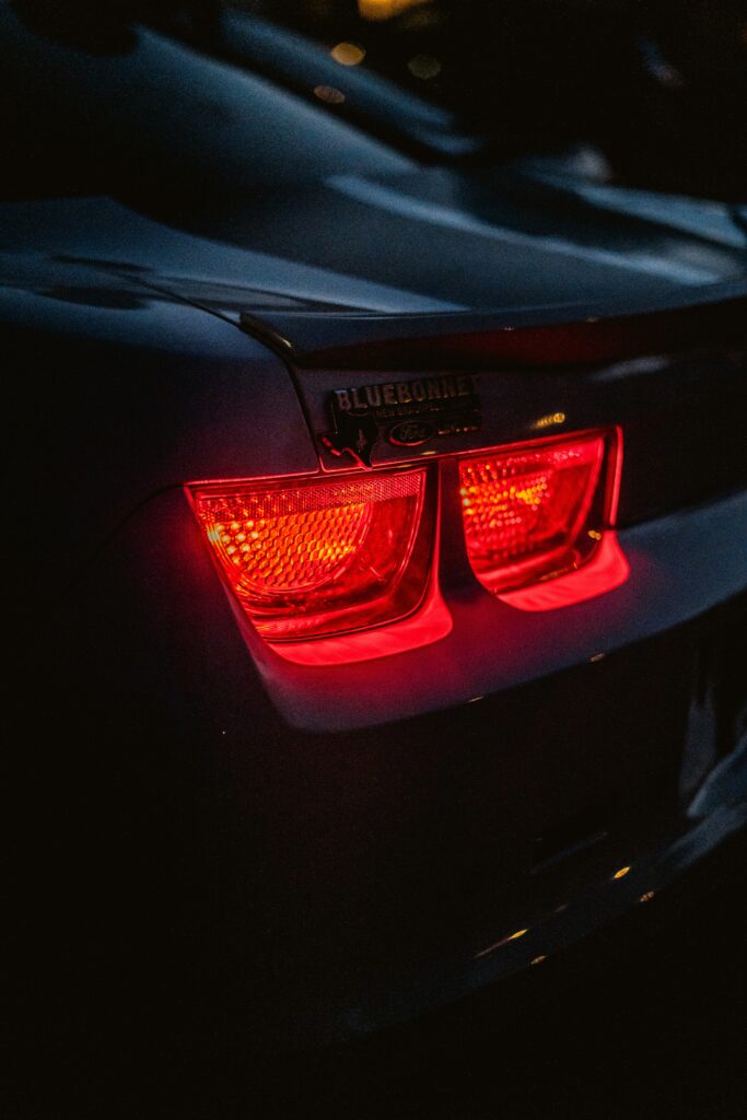 Stunning Ford Car Wallpaper: Close-Up Rear with Illuminated Red Lights
