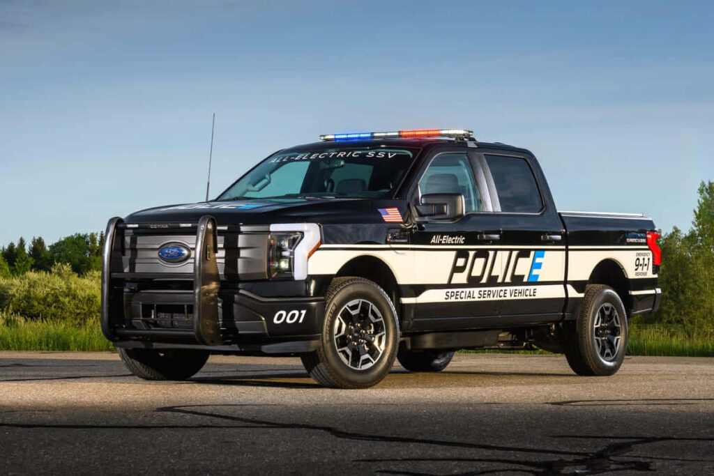 Ford F-150 Police Special Service Vehicle with bold graphics against a serene outdoor backdrop wallpaper