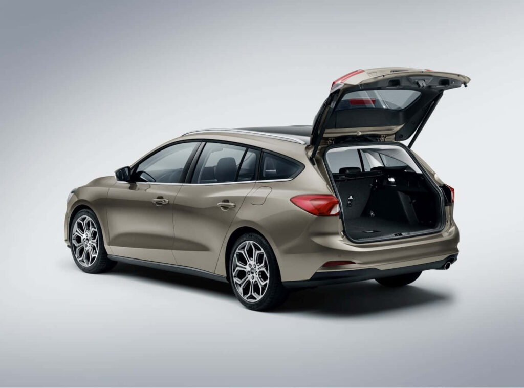 Ford Focus wagon rear hatch open showing spacious cargo area against minimalist background Wallpaper