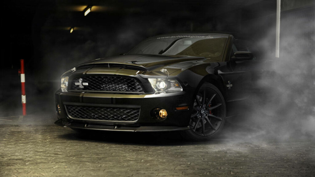 “Sleek Ford Mustang Cobra GT500 Wallpaper in Dramatic Smoky Setting”