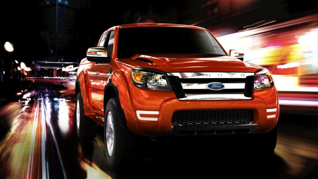 Ford Ranger speeding through vibrant cityscape showcasing power and adventurous design wallpaper