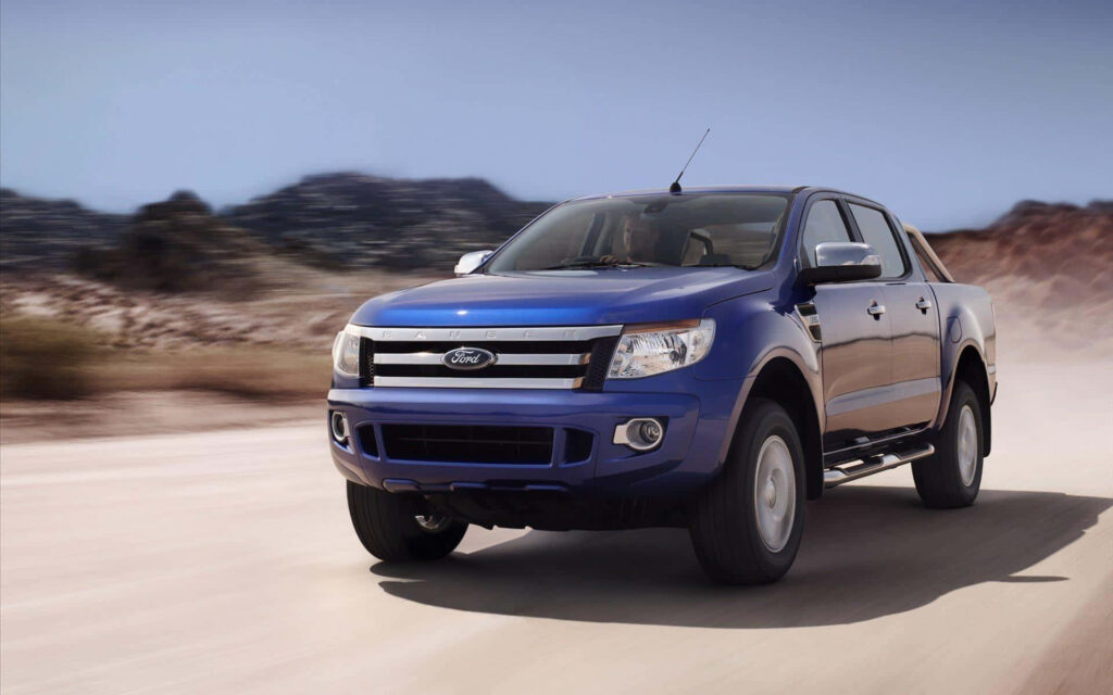 Ford Ranger driving rugged terrain adventure wallpaper background dynamic offroad truck