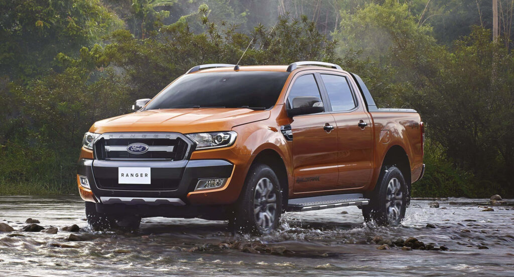 Ford Ranger off-road driving through shallow river rugged design outdoor adventure wallpaper background