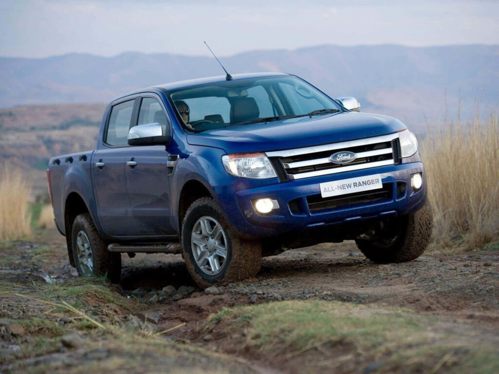 Ford Ranger off-road driving rugged trail showcasing robust design and adventurous spirit wallpaper