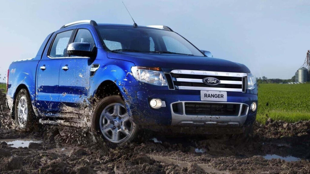 Ford Ranger off-road charging through muddy terrain rugged truck showcasing bold design wallpaper